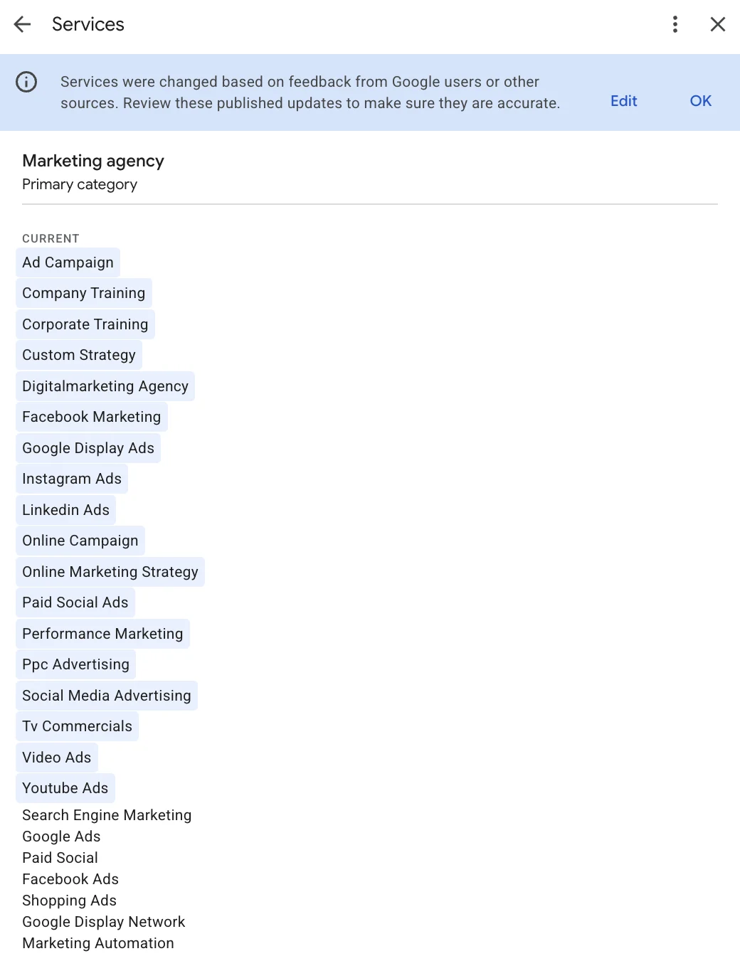 The Business Profile services screen, with a banner saying services were changed based on feedback from Google users or other sources